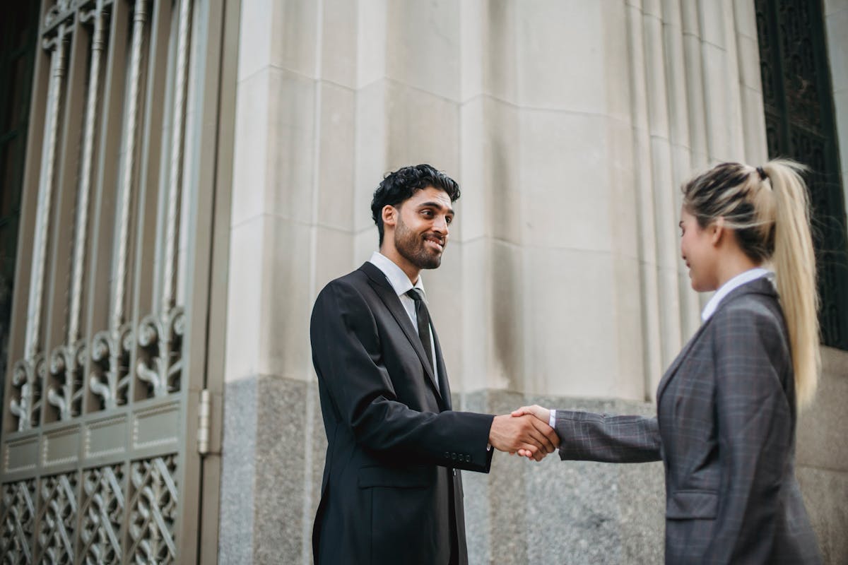 Business People Meeting Outdoors Shaking Hands