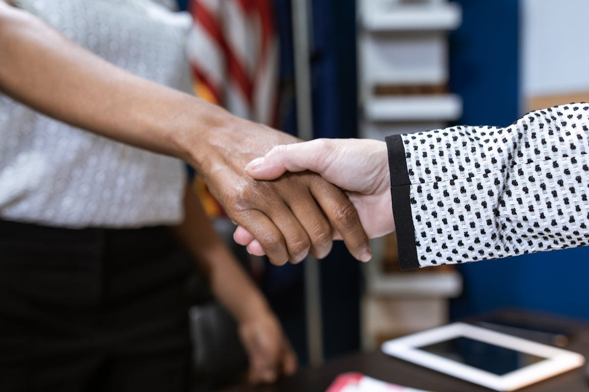 Two People Shaking their Hands