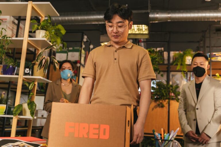 A Man Standing Beside the Brown Box