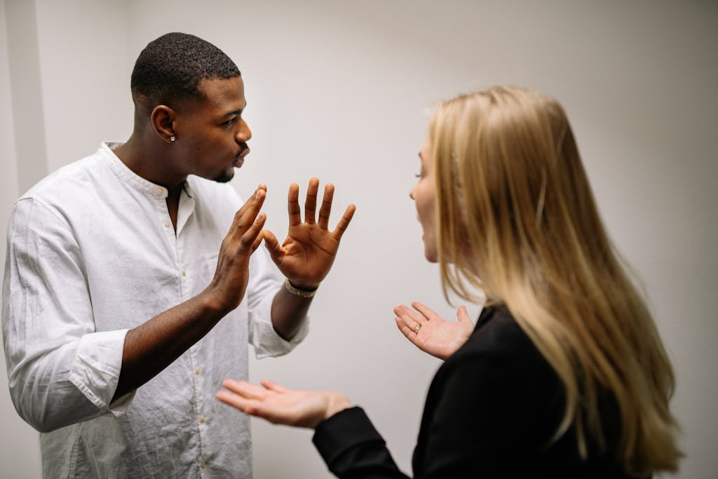 Man in White Dress Shirt Holding Womans Face