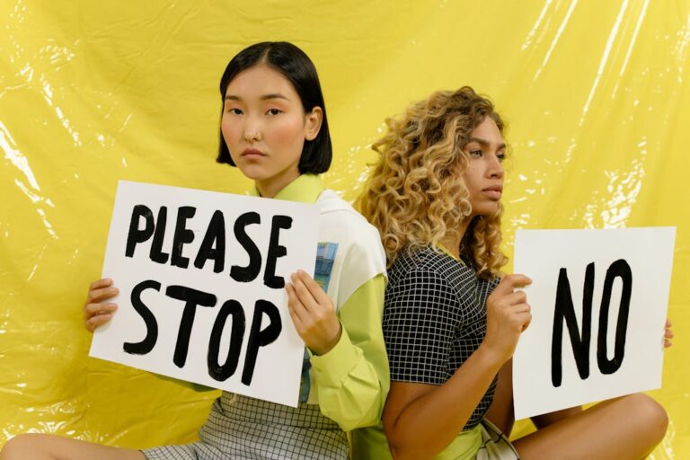 Two Woman Holding a Banner