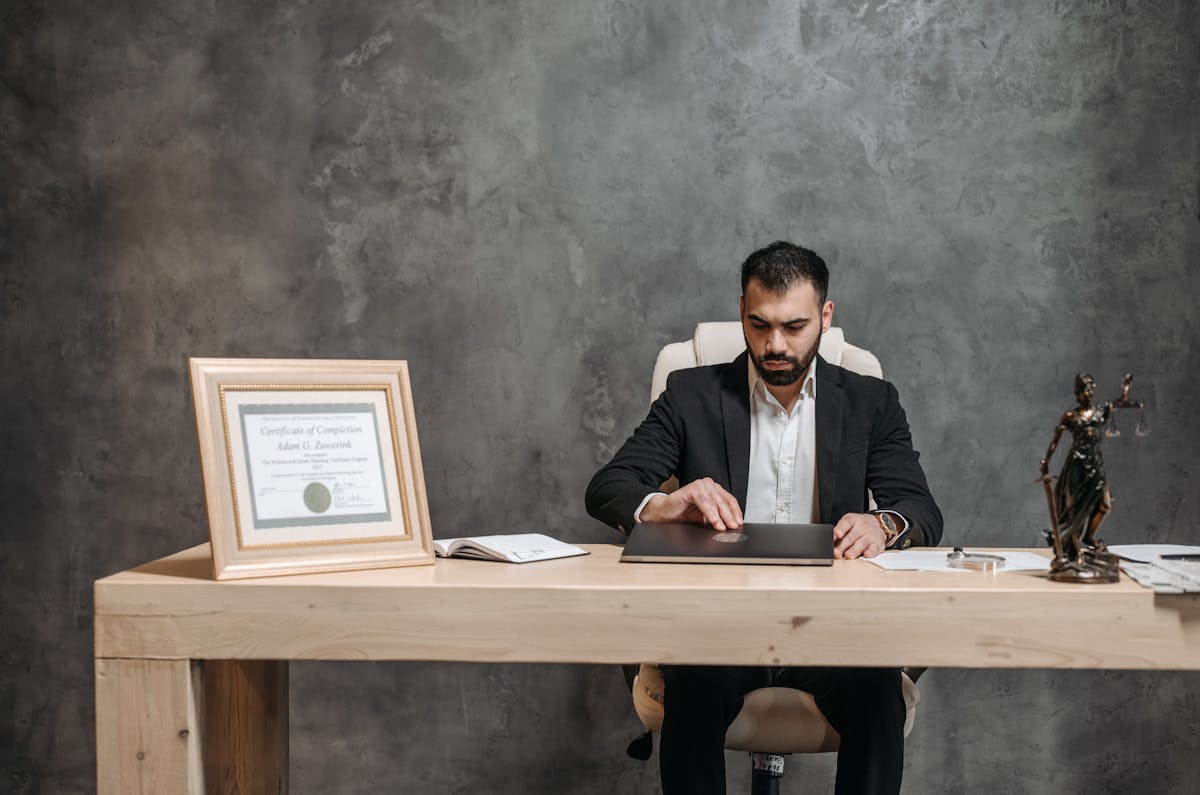 bearded lawyer working at his office desk, showing professionalism and expertise.